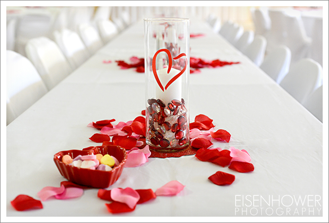 the church's founders hall was adorably decorated with white linens and Valentine's Day themed centerpieces